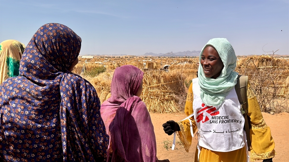 msf employee talking to two women