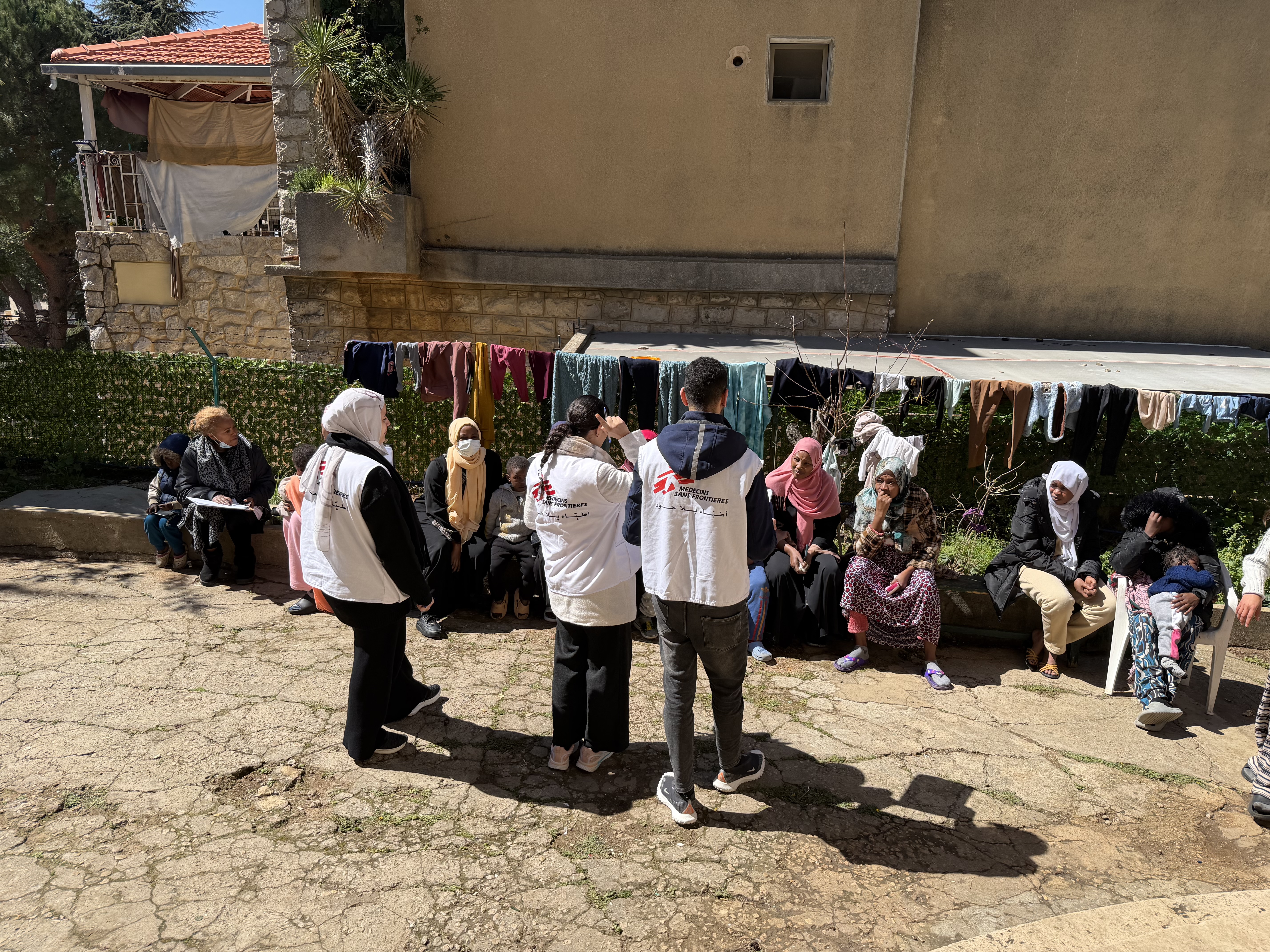 mobile clinic talking to patients in Ghosta
