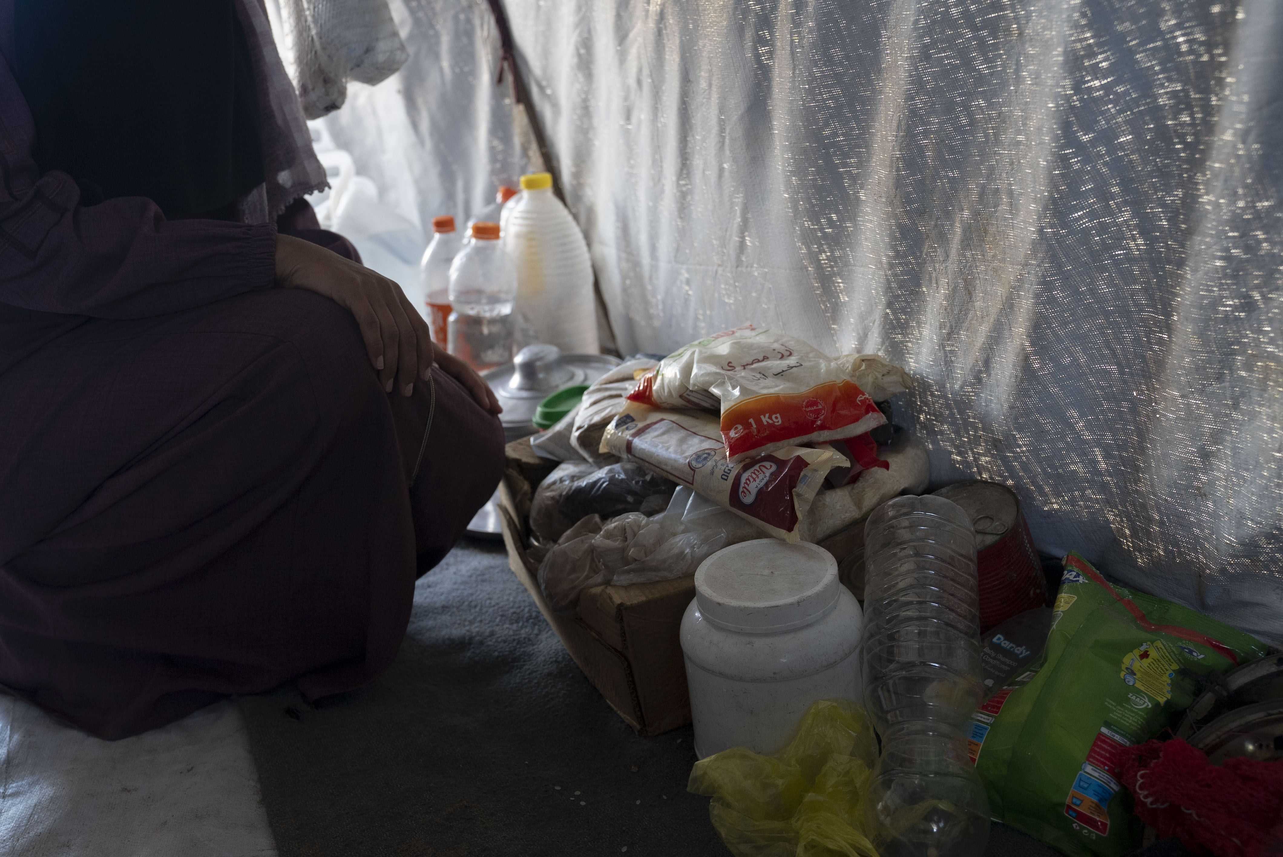 Food items of Sahar Nafez Salam in the tent where she lives in a camp for displaced people in Khan Younis, Gaza, in the Occupied Palestinian Territory.