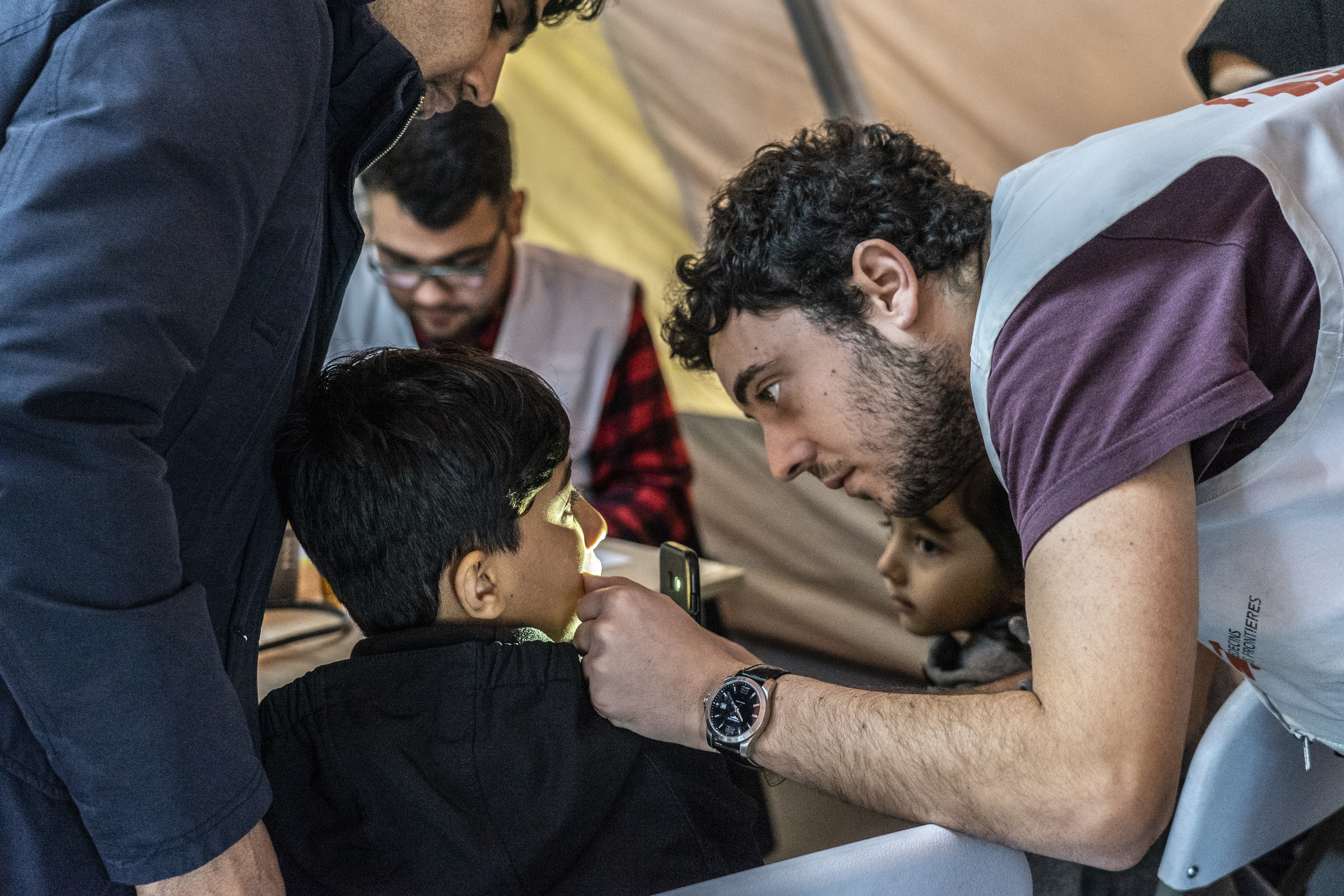 MSF doctor Leonidas Alexakis examines a child in the MSF pediatric clinic outside Moria camp on Lesbos island in Greece. MSF medical staff see around 80-100 children per day with illnesses directly related to living in such awful conditions.