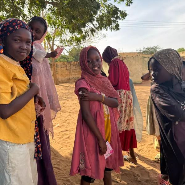 Ten-year-old Reem celebrates with a smile after receiving her measles and rubella vaccine in Alsafa, El Geneina. After showing her younger siblings that 'it only pinches and goes away quickly', Reem stood tall and encouraged her family.
