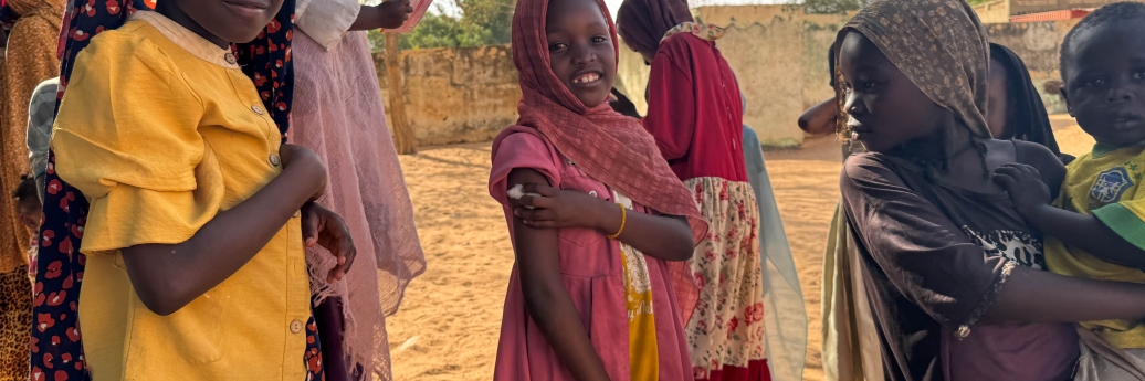 Ten-year-old Reem celebrates with a smile after receiving her measles and rubella vaccine in Alsafa, El Geneina. After showing her younger siblings that 'it only pinches and goes away quickly', Reem stood tall and encouraged her family.