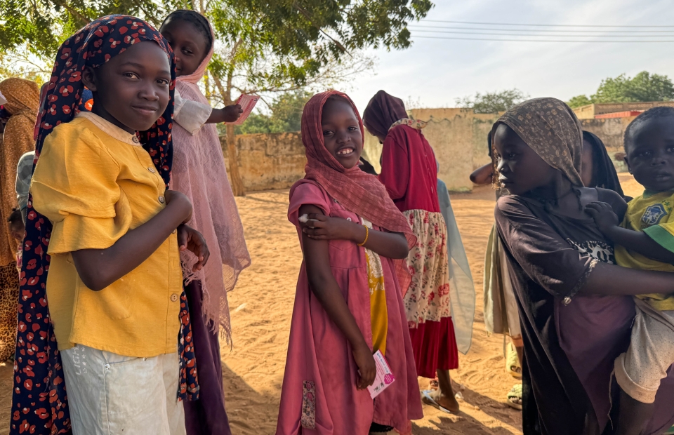 Ten-year-old Reem celebrates with a smile after receiving her measles and rubella vaccine in Alsafa, El Geneina. After showing her younger siblings that 'it only pinches and goes away quickly', Reem stood tall and encouraged her family.