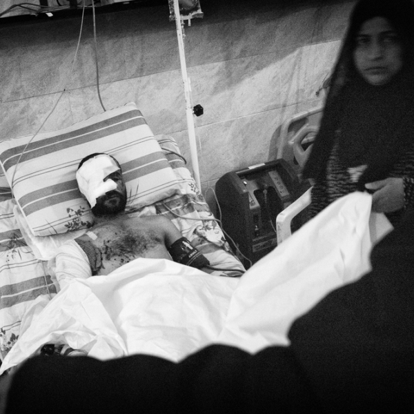 Un patient dans son lit d'hôpital © Eddy Van Wessel